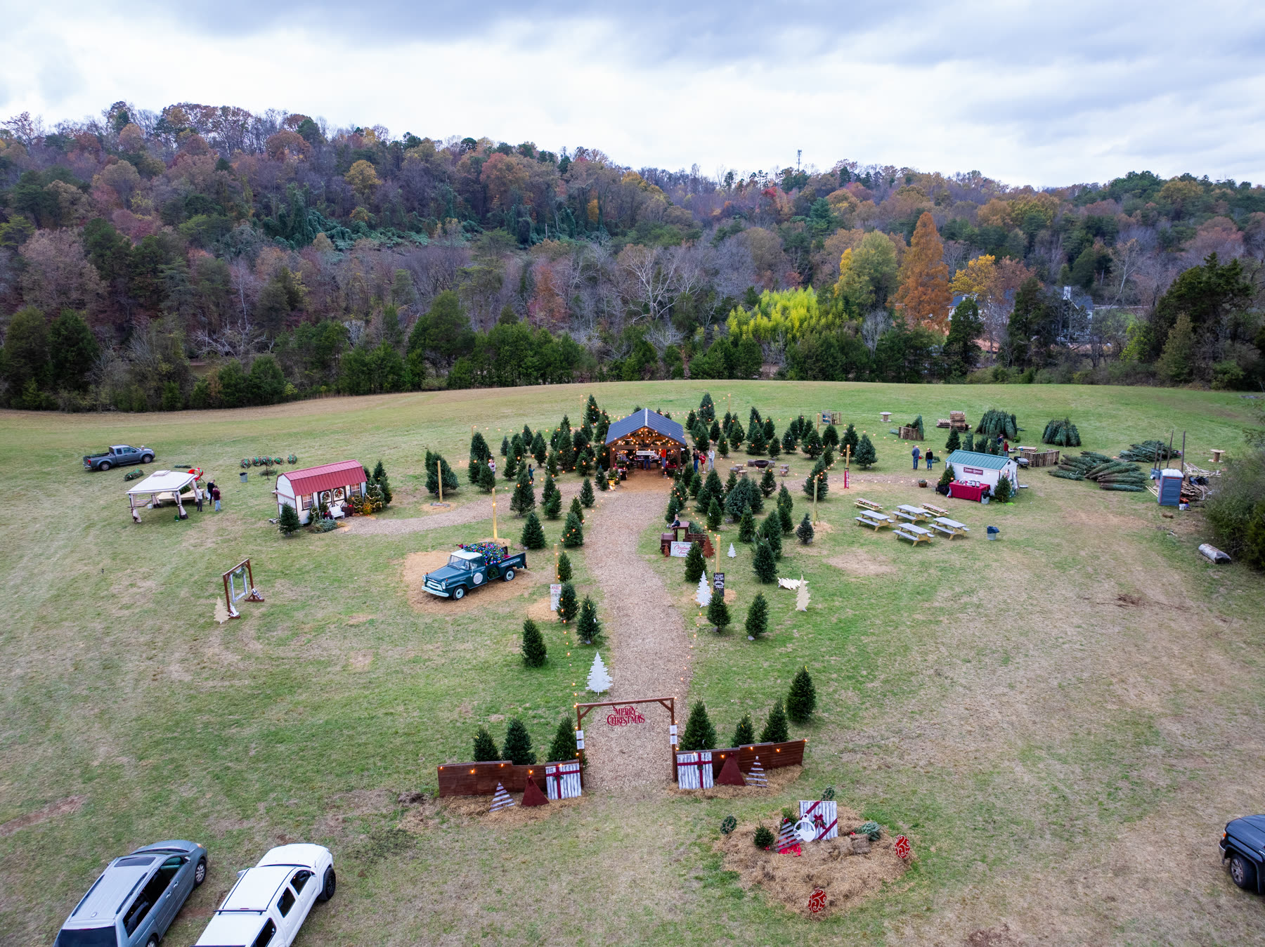 Aerial view of the Raise the Tree pick-out lot, vintage truck, and pavilion in Louisville